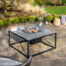 Cosiloft 100 Black and Grey Fire Pit Table life style shot with glass