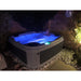 RotoSpa DuraSpa S160 granite grey and grey lifestyle outdoor arrangement night setting with tub lights on 