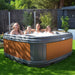 RotoSpa DuraSpa S160 Granite grey and teak lifestyle outdoor arrangement with 4 people bathing 