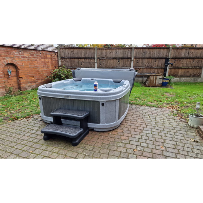 RotoSpa DuraSpa S160 Light grey and grey lifestyle outdoor arrangement with spa steps