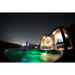 RotoSpa QuatroSpa Granite grey and grey panel lifestyle outdoor night setting with lights wide with night sky view