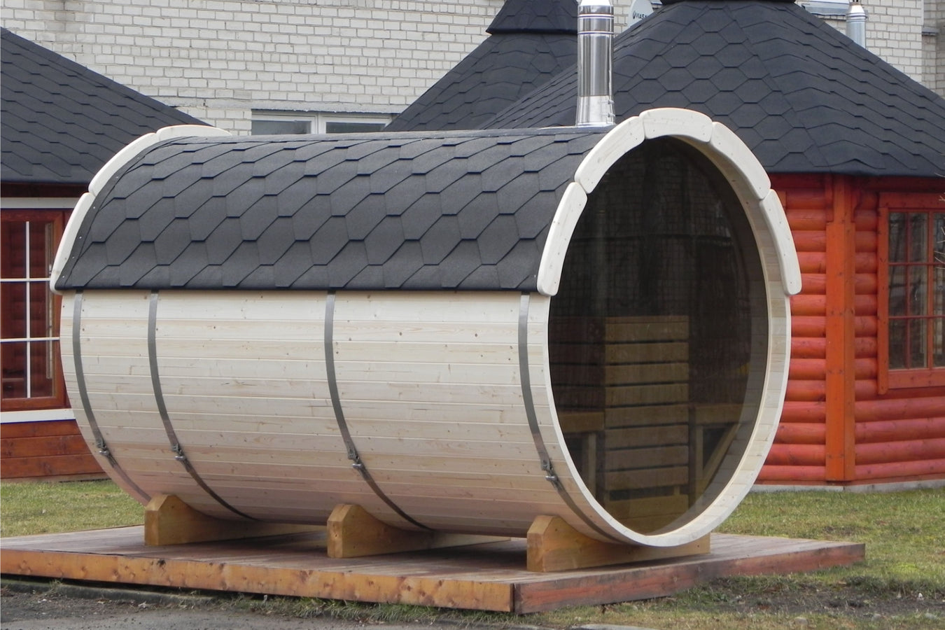 Sauna barrel lifestyle outdoor arrangement on a wooden platform