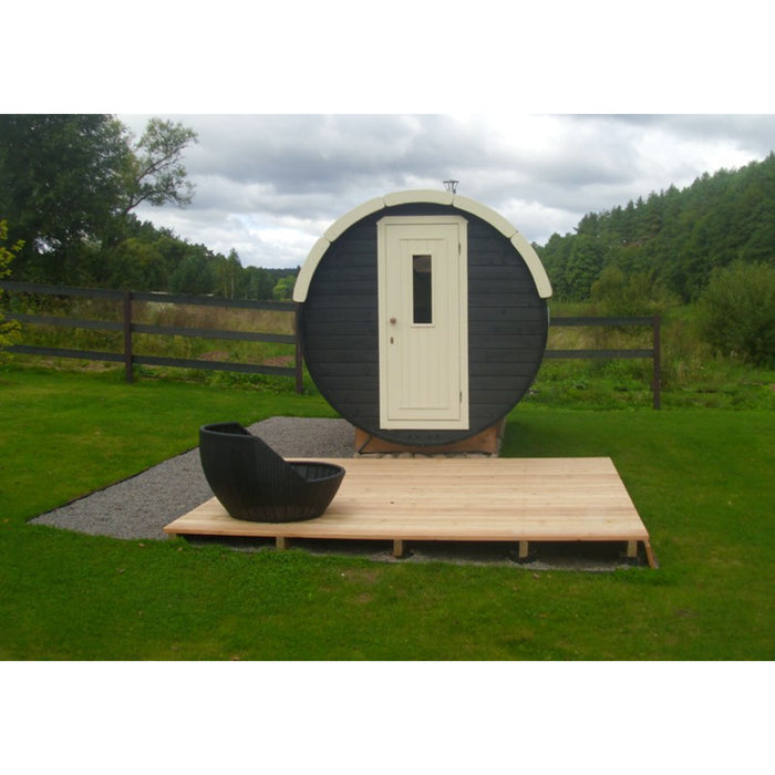 Viking Industrier Barrel Sauna 2.2 x 4m outdoor arrangement field view with black couch on wooden platform
