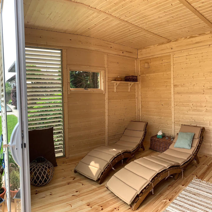 Viking Industrier Sauna Cube 3 x 5m with Lounge outdoor lifestyle inside view with two long resting chairs